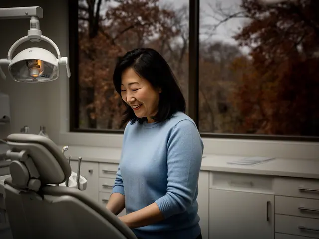A dentist standing beside a dental chair.
